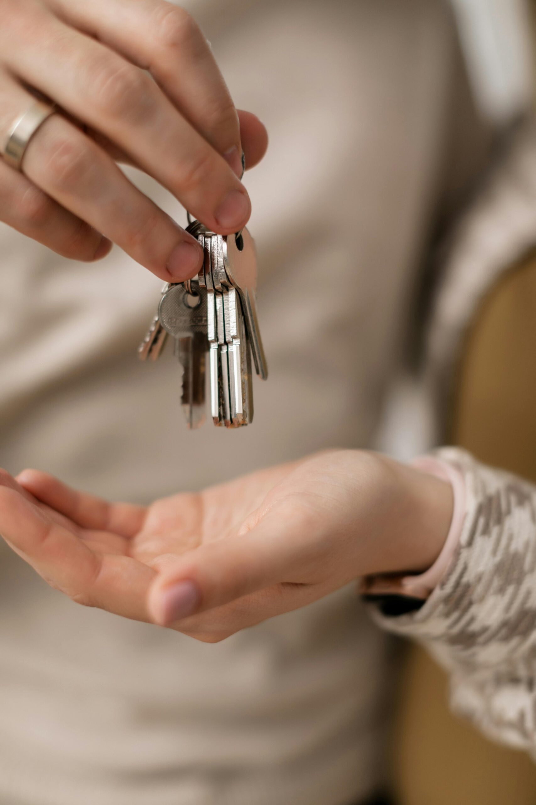 pexels-a-darmel-7641904 handing over keys to home